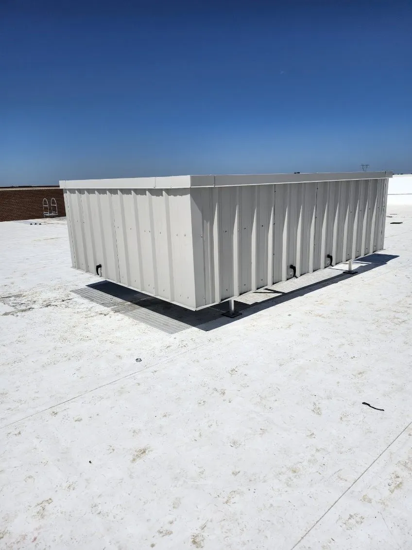 Ash gray solid-panel RTU screen on a white commercial rooftop